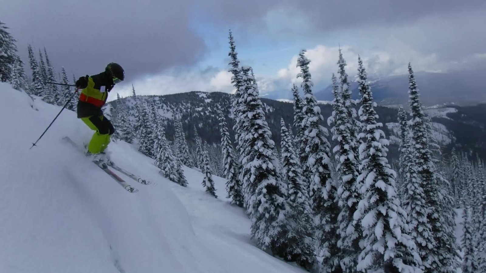 Person skiing down mountain.