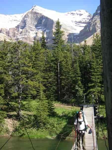 Crossing a suspension bridge over the Belly River in Glacier National Park.