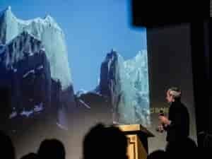John Roskelley shares stories of expeditions that were most important to him to a packed theater of 700 people, including photographers and journalists from all over Europe. Photo: Piolets d'Or