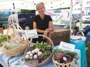 Tarawyn Waters of Urban Eden Farms in Vinegar Flats sells veggies at the Spokane Farmers' Market. Photo: Shallan Knowles