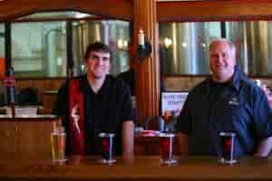 Chase Sanborn pouring cold ones at Wallace Brewing. Photo courtesy of Chase Sanborn.