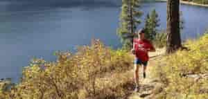 Trail running along Sullivan Lake shoreline by Jon Jonckers.
