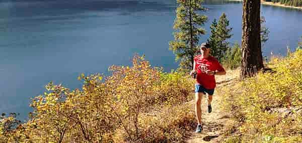 Trail running along Sullivan Lake shoreline by Jon Jonckers.