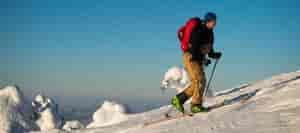 Photo of man skinning uphill.