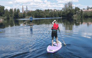 Photo of paddleboarders on the Spokane River by Cara Quien.