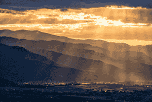 Photo of mountains at sunset by Aaron Theisen