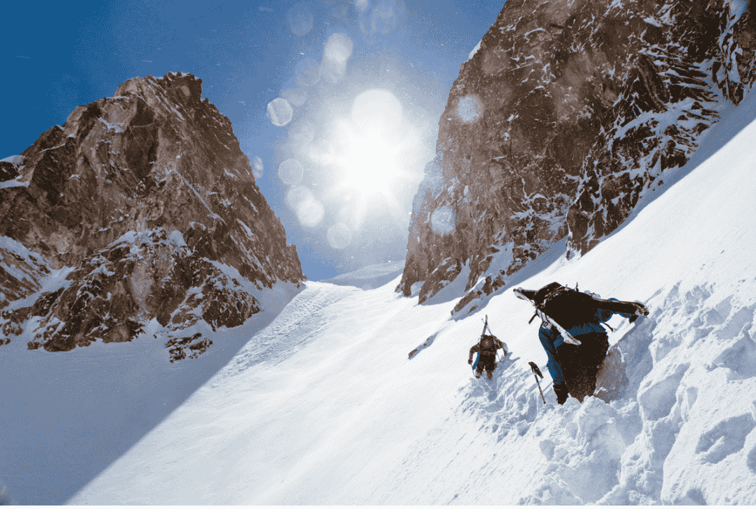 Photo from Winter Wildlands Alliance re: Backcountry Film Festival. Mountaineer skiers approach a steep chute.
