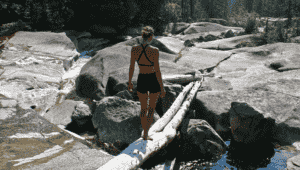 Photo of girl balancing on log by Katie Botkin.