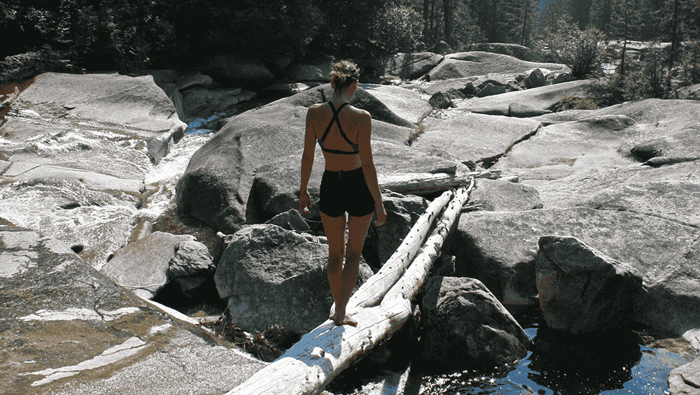 Photo of girl balancing on log by Katie Botkin.