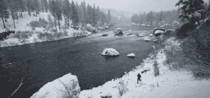 Photo of runner along the banks of the Spokane River.