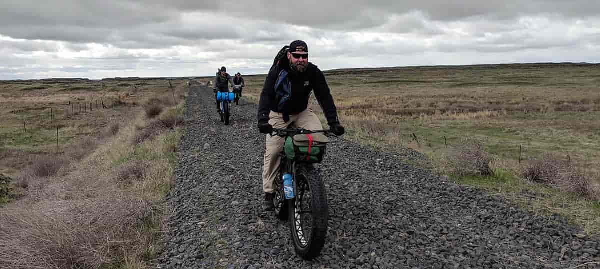 Photo of three bikerpackers on the Columbia Plateau Trail.