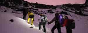 Photo of climbers kicking steps on Kilimanjaro.