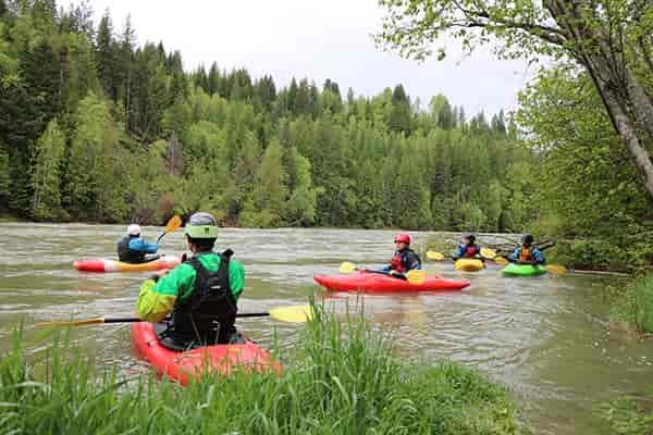 Photo of kayakers on river.