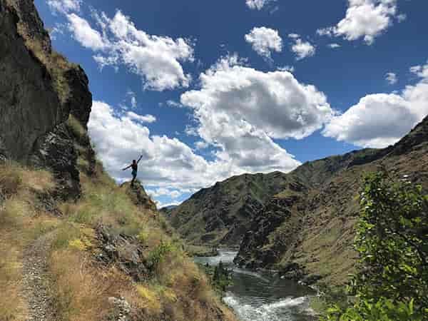 Photo of author standing on rock outcropping overlooking the Snake River.
