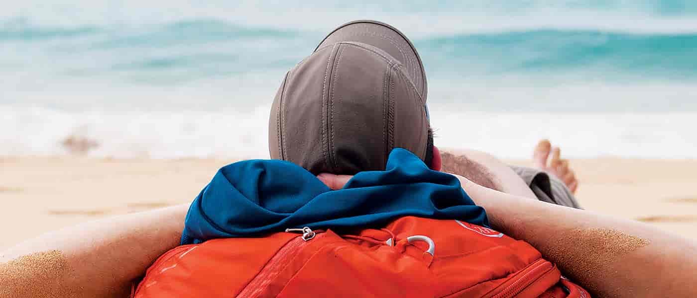 Photo of man relaxing on the beach.
