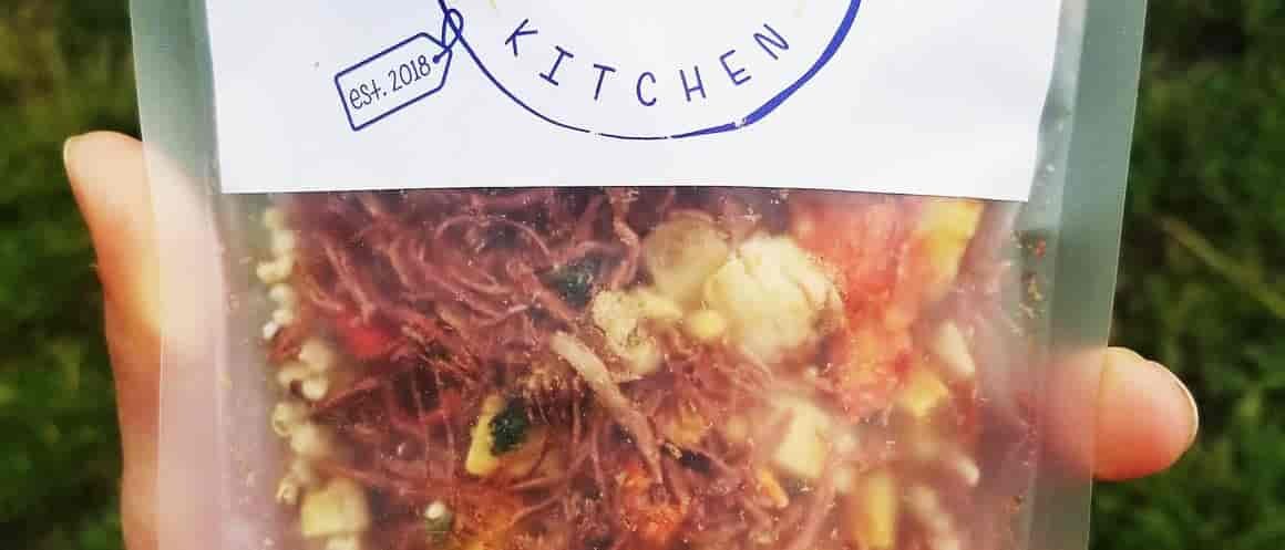 Photo of person's hand holding a bag of freeze dried corned beef hash from Bushka's Kitchen.