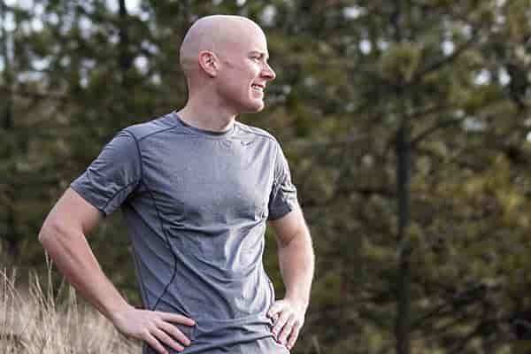 Photo of Peter Hawkins posing mid-run.