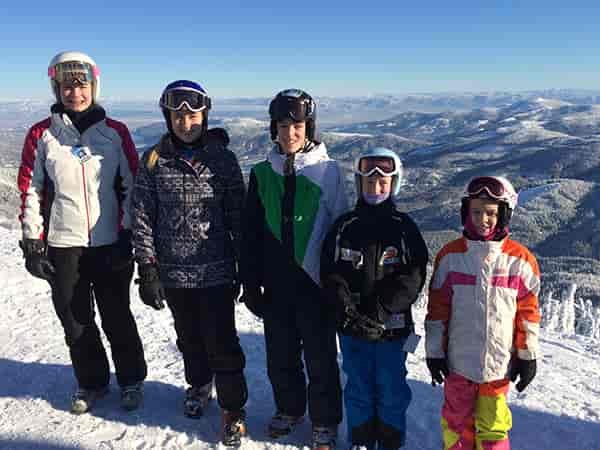Photo of Fletcher grandkids posed on side of ski slope.