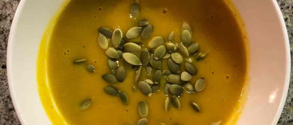 Photo of Curried Pumpkin Apple Soup in a bowl.