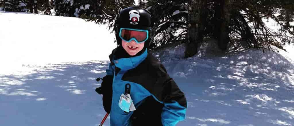 Photo of young boy tree skiing.