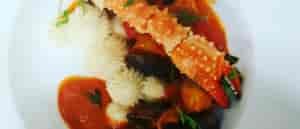 photo of crab leg and pasta.