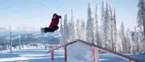 Owen Cline throwing a method grab at Mt. Spokane's Jingle Rails.
