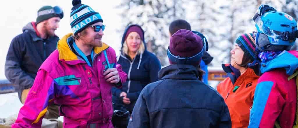 Photo of skiers wearing beanies, or toque