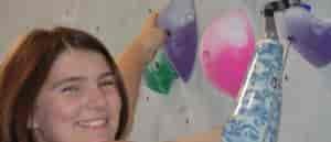 Photo of Helen McGear on the climbing wall.