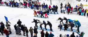 Photo of teams "smooshing" down the center of a crowd.