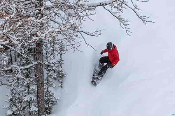 Photo of snowboarder in powder.
