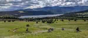 Photo of mountain bikers at the Saltese Uplands from above.