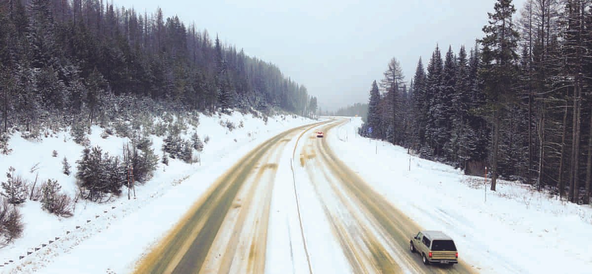 View of a snowy interstate-90 from the overpass at Lookout Pass.