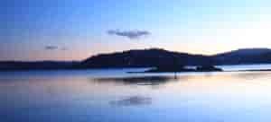 Moon over Coeur d'Alene Lake at sunset.