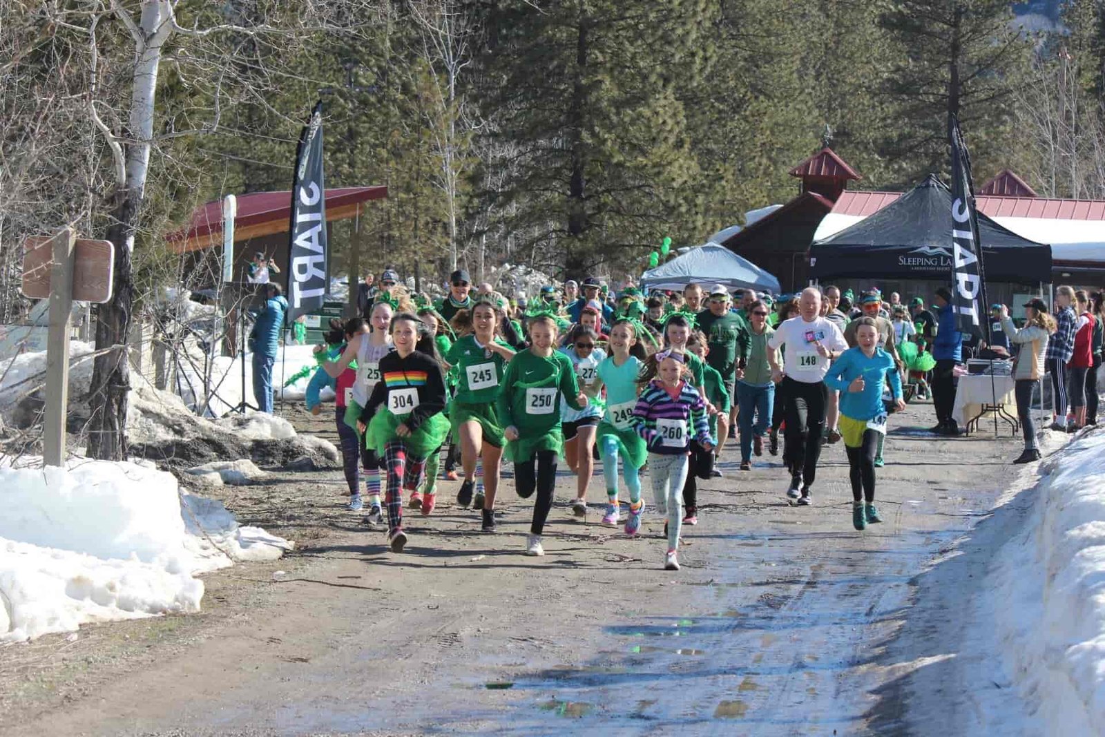 A bunch of people starting a fun run race.