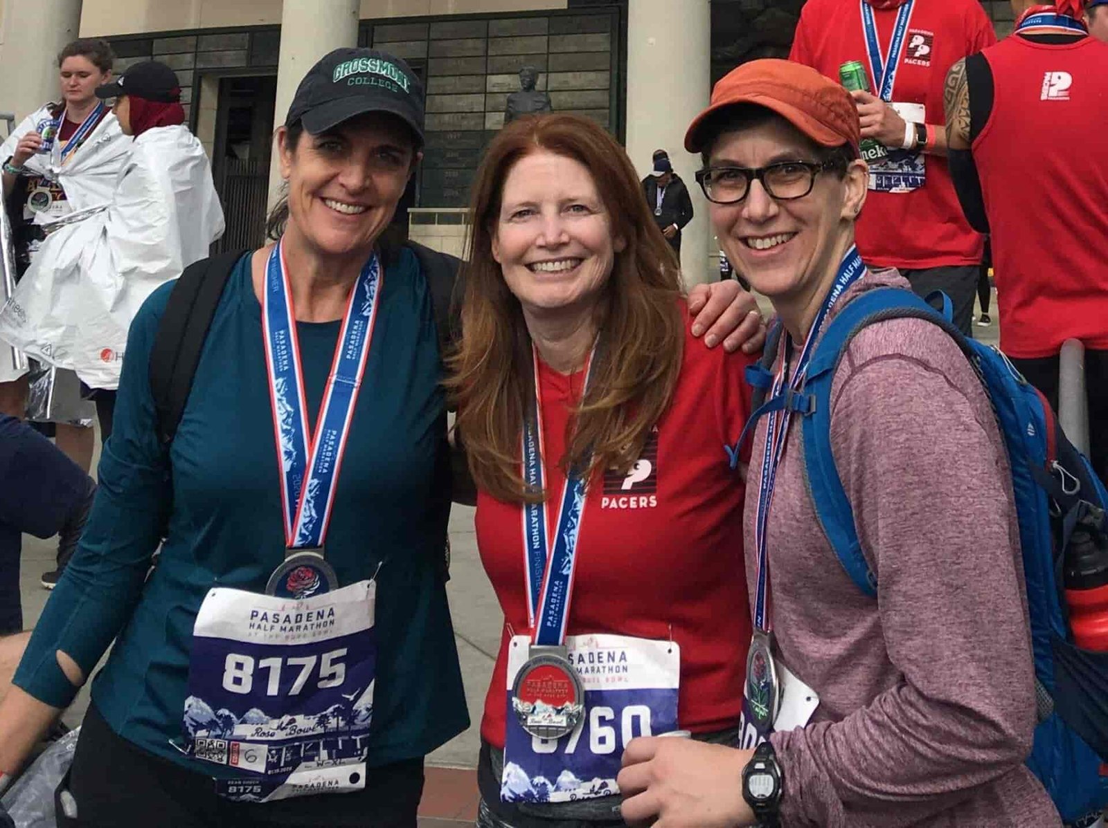 A friend group smiling before a marathon.