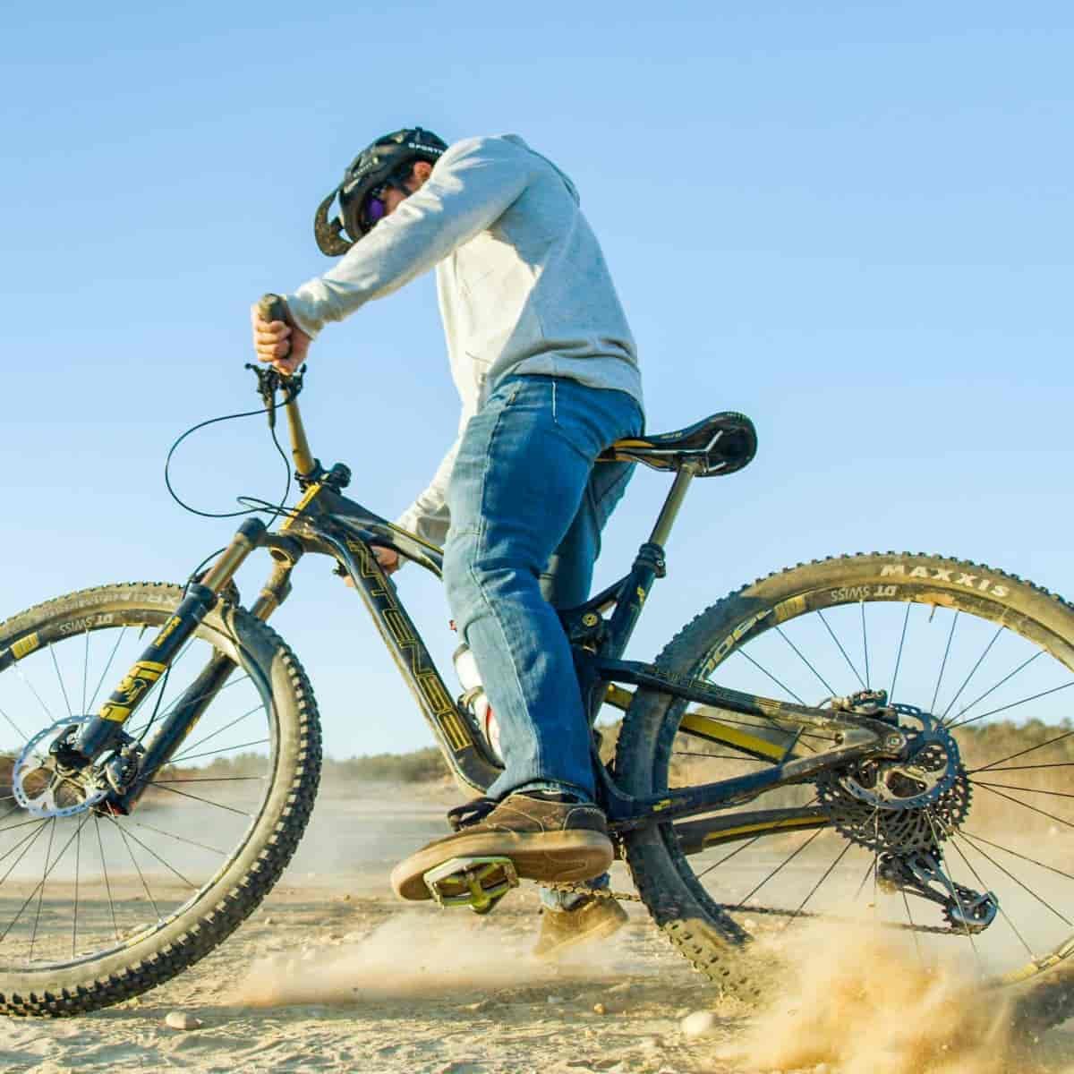 Man skidding through dirt.