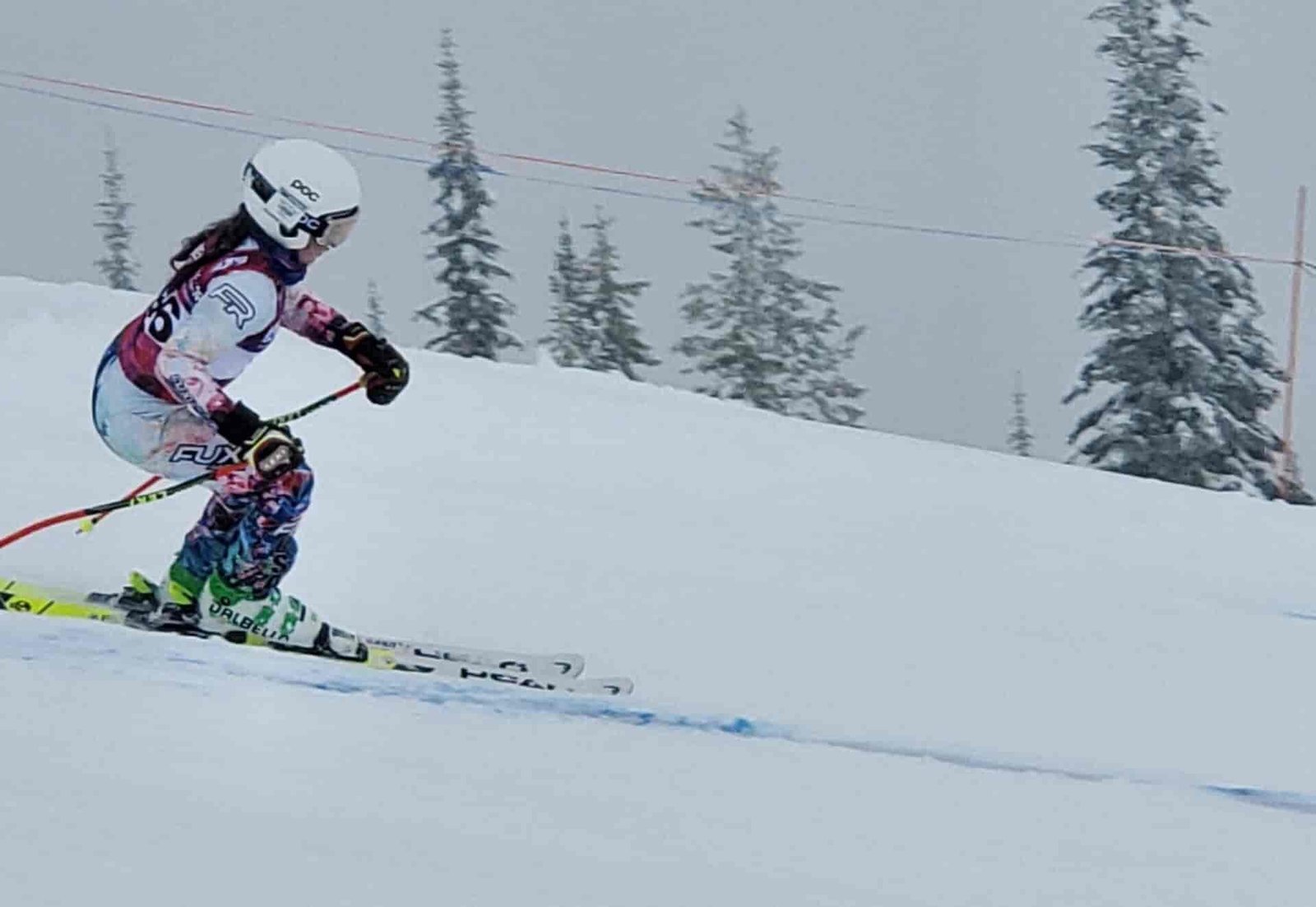 Ski Racer skiing down hill.