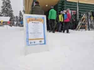 Winterfest sandwich board sign in the snow
