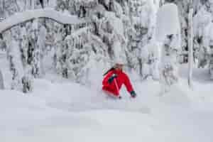 Skier making turns in deep powder at Lookout Pass in Mullan, Idaho.
