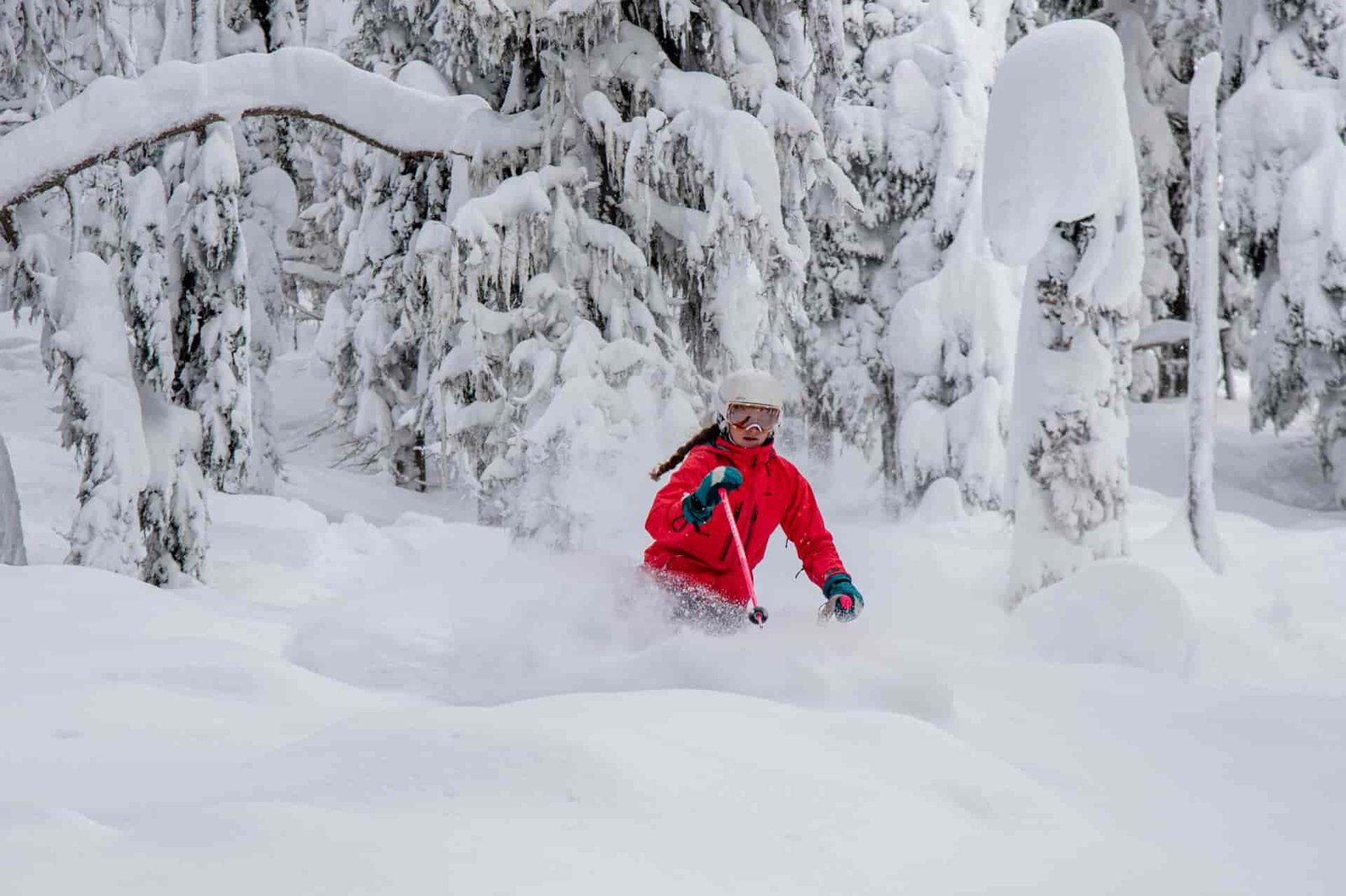 Skier making turns in deep powder at Lookout Pass in Mullan, Idaho.